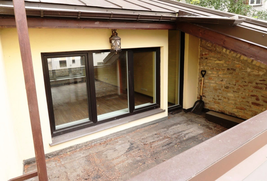 Outdoor balcony with large windows