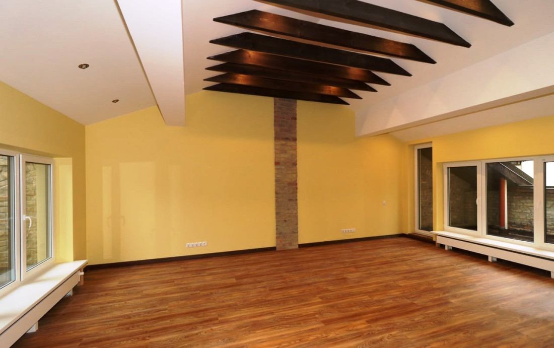 Living room with metal beams and wooden floors