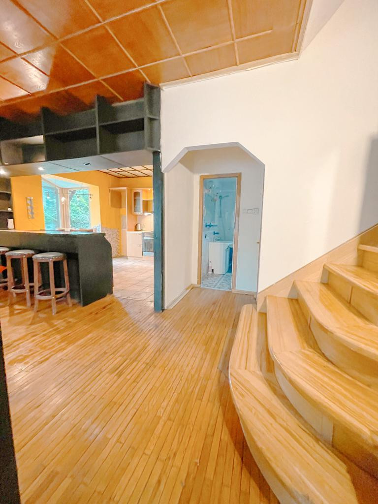 Entrance hall with wooden floors and stairs