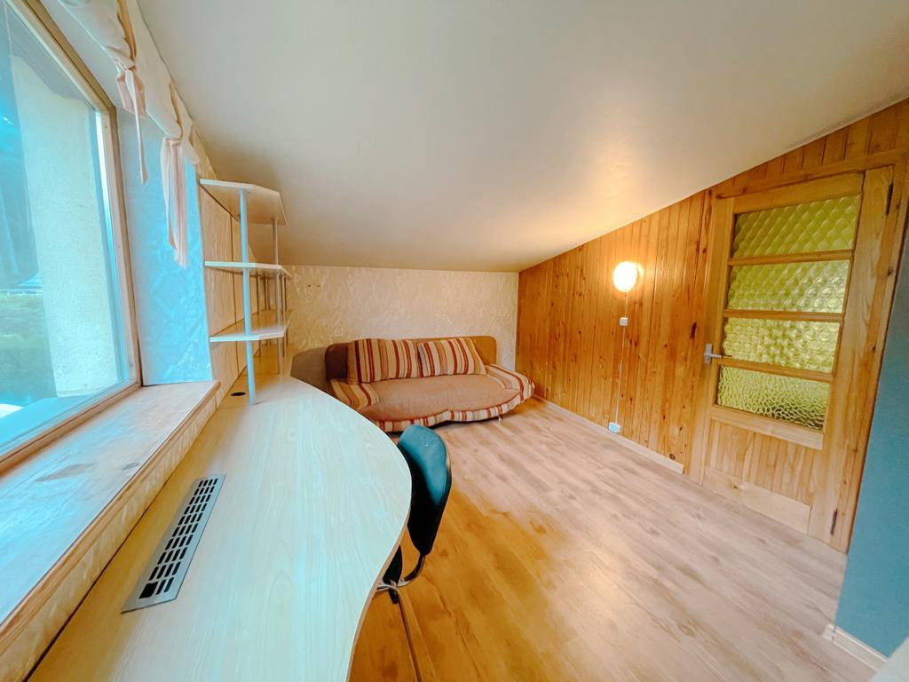 Home office with desk and sofa
