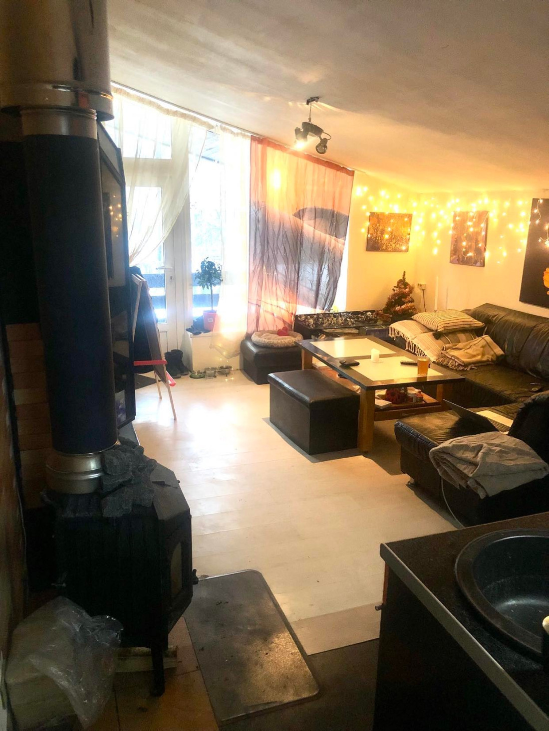 Living room with decorations and stove
