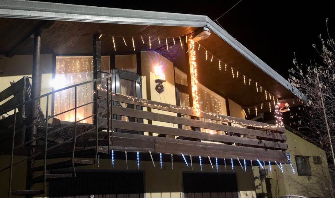 Balcony with festive lights at night
