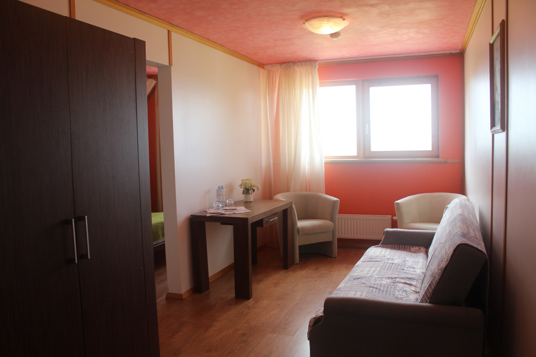 Room with a table and two chairs.