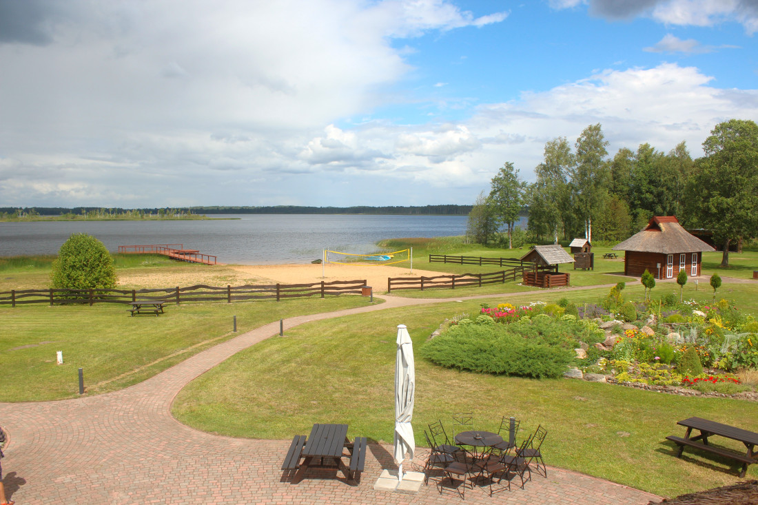 Lakefront with beach and terrace view.
