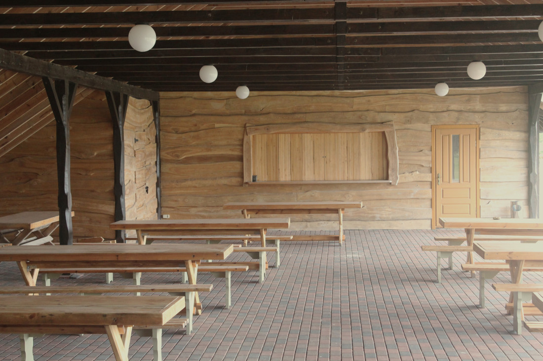 Spacious shelter with wooden walls.
