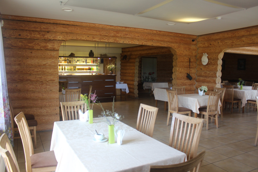 Restaurant interior with round tables.