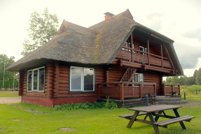 Cozy wooden cottage with traditional roof.