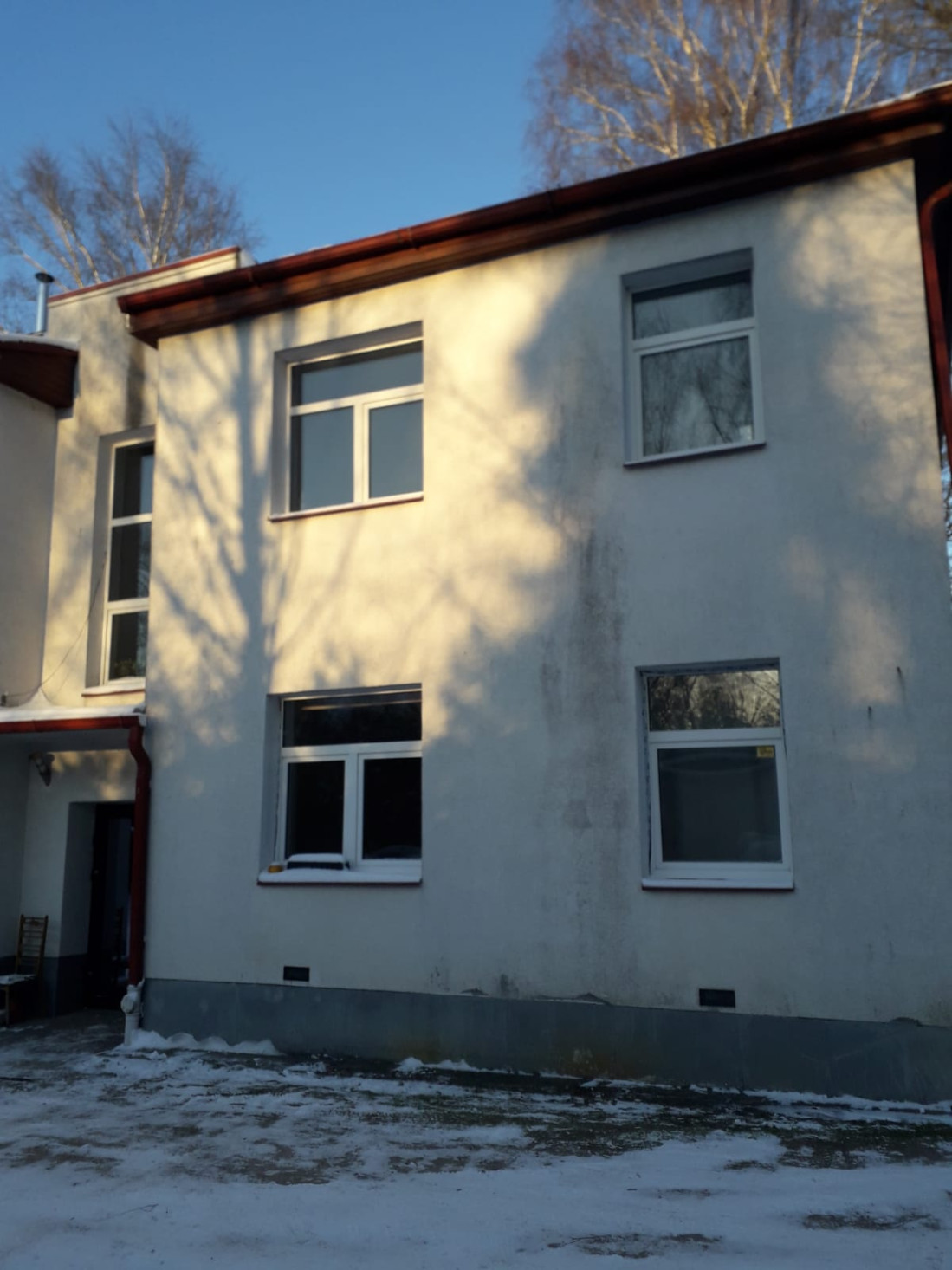 The front door of the house is on the back side