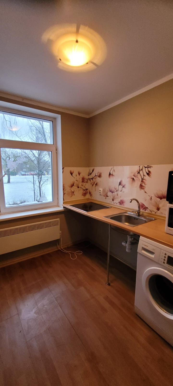 Kitchen with sink, electric cooker and washing machine 