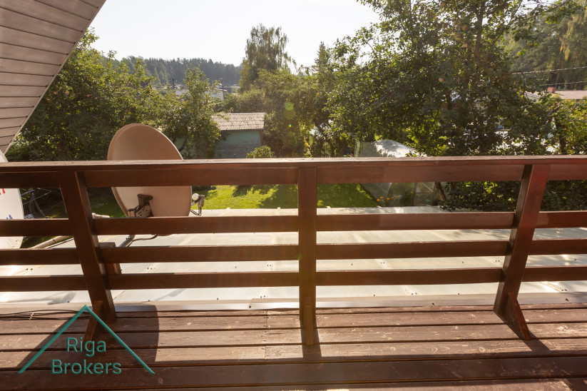 Balcony overlooking garden and surroundings.