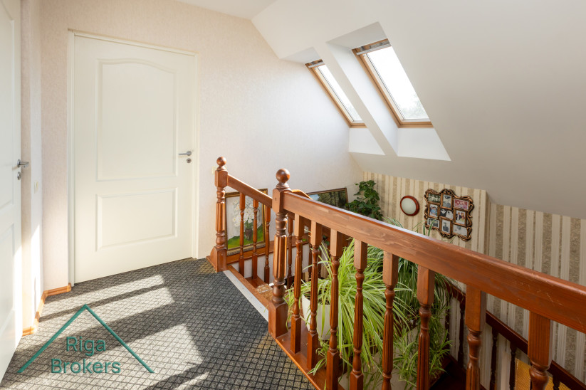 Wooden railings and windows with natural light.