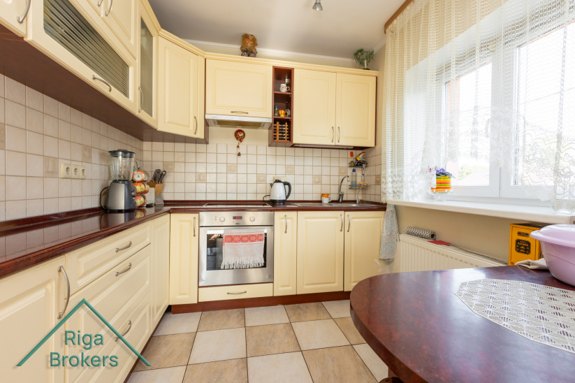 Bright kitchen with yellow cabinets.