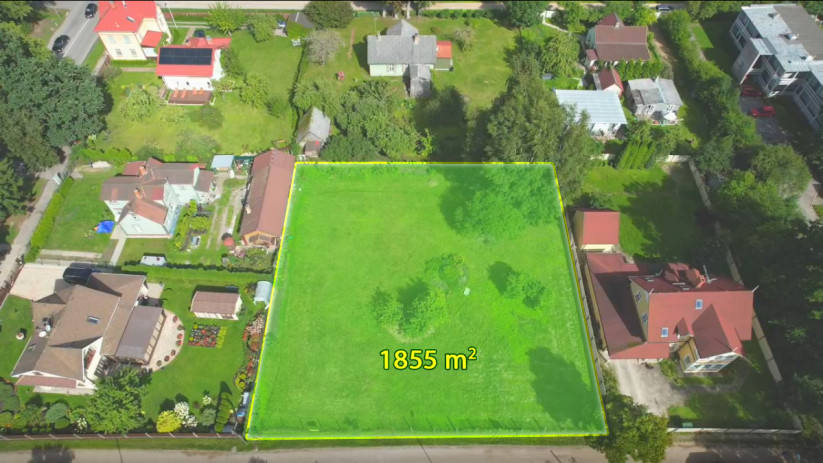 The area of the plot is 1855 square metres