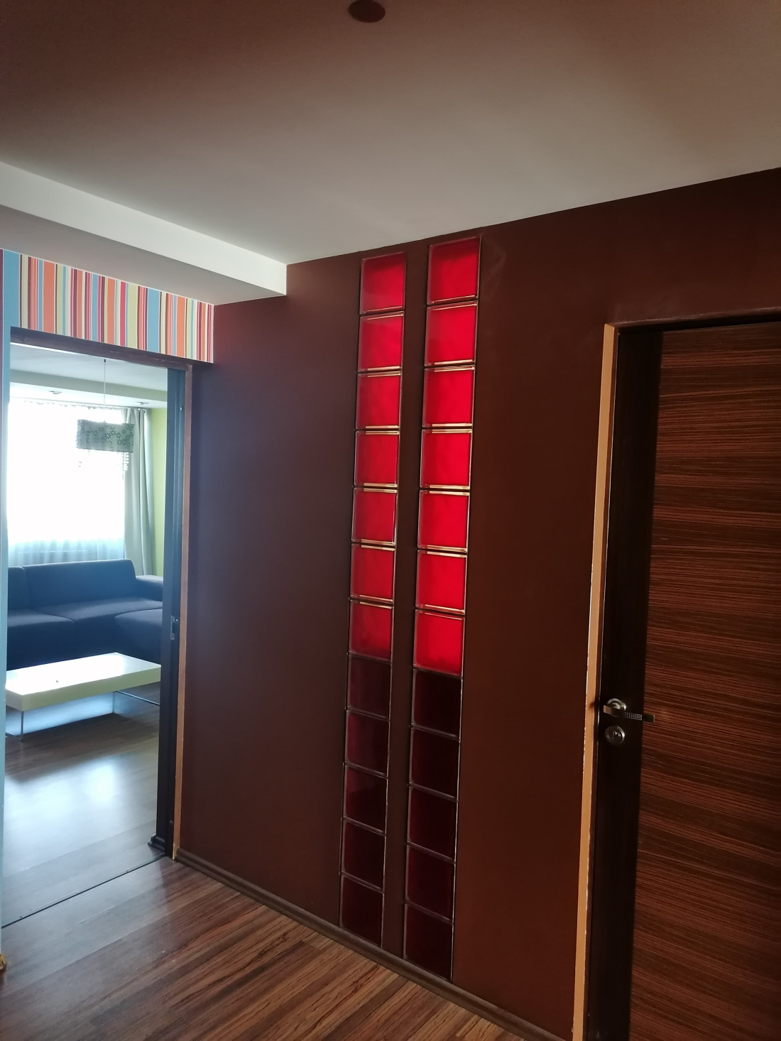 Bright hallway with glass wall.
