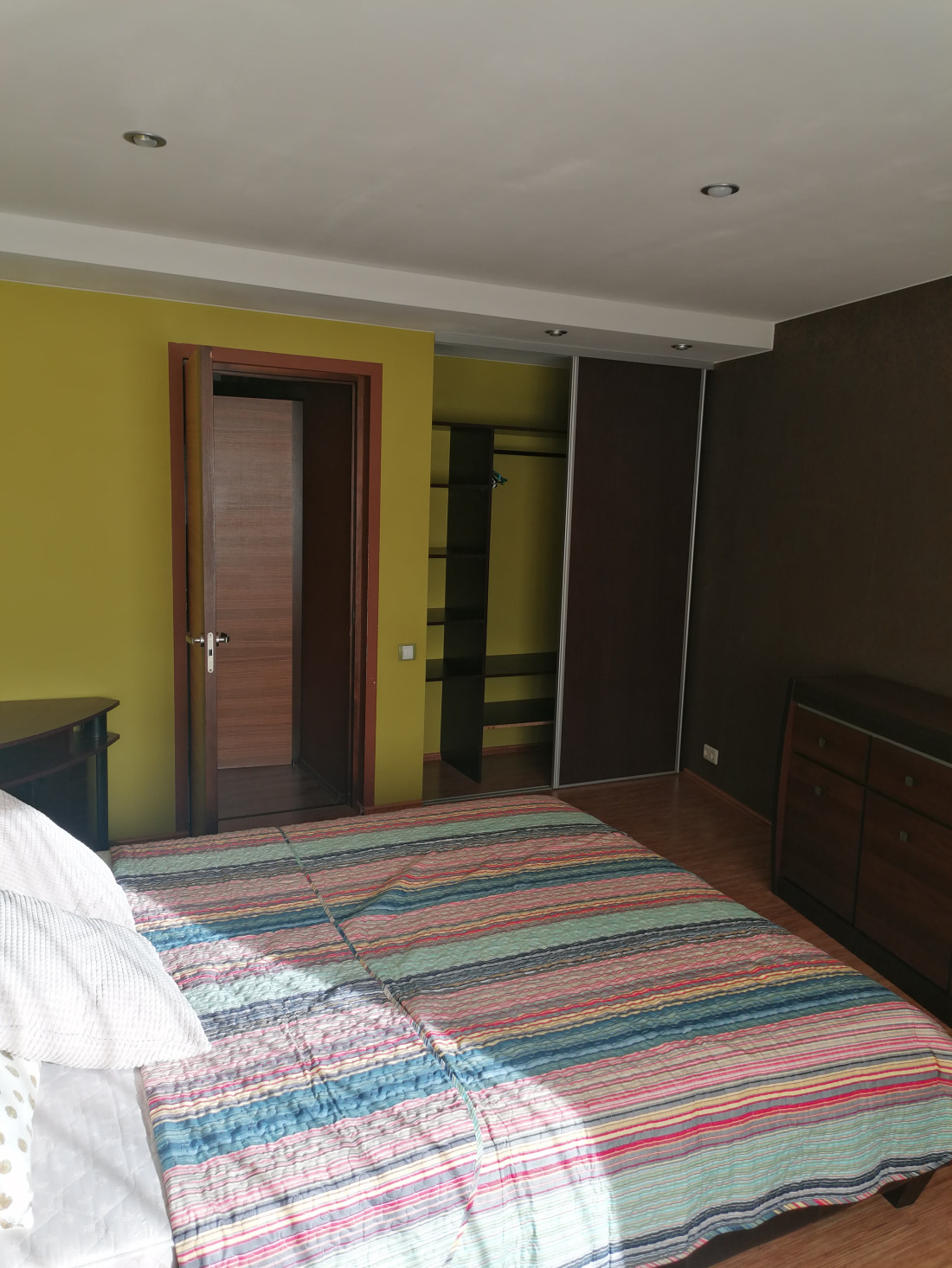 Bedroom view with open doors.