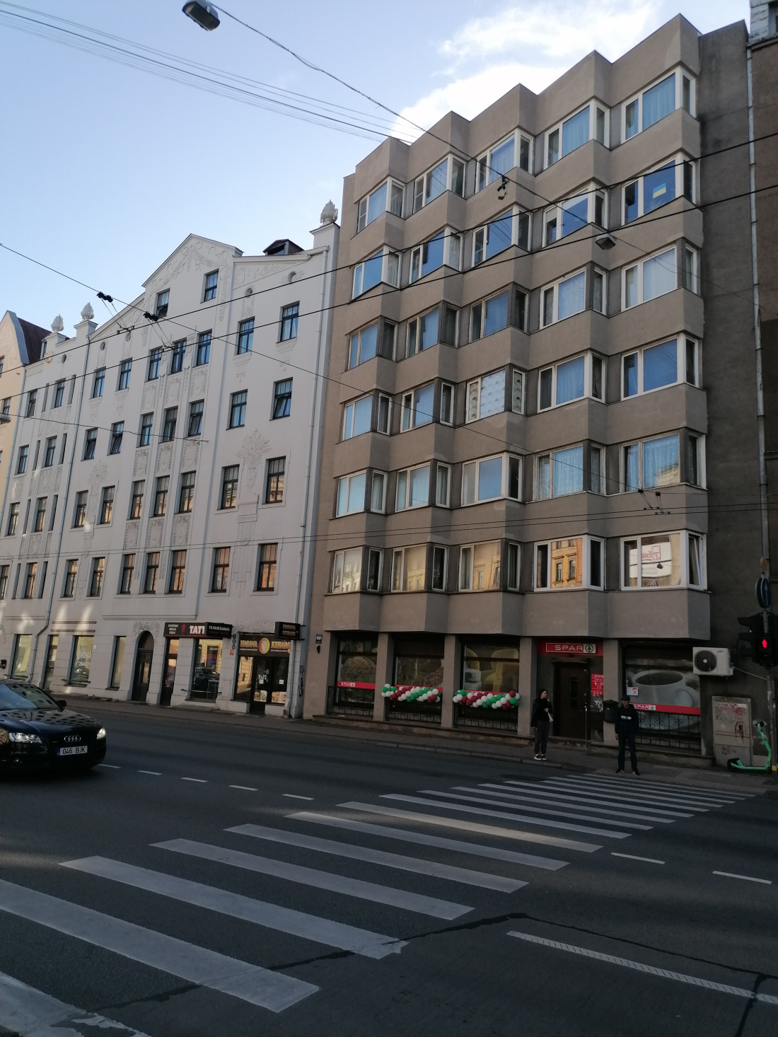 Apartment building with store below.
