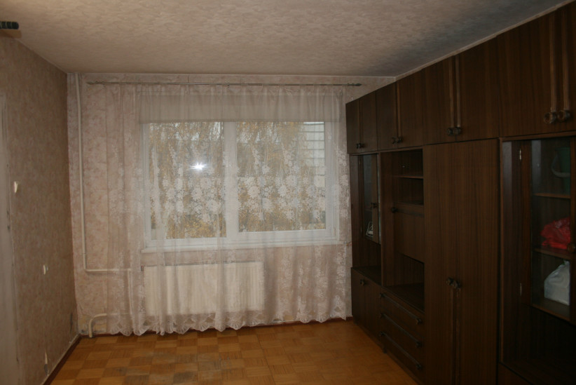 Bright living room with cabinet.