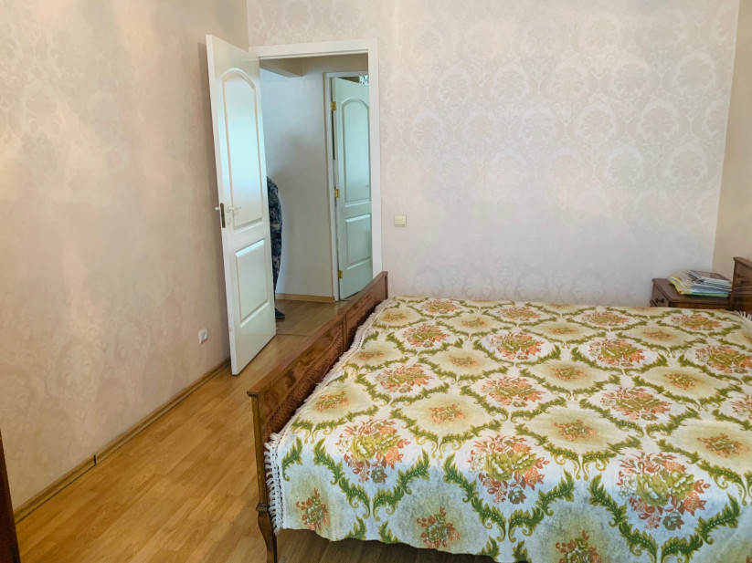 Bedroom with light walls and doors.