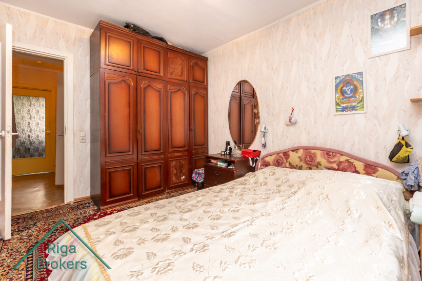 Bedroom with a large wooden wardrobe.