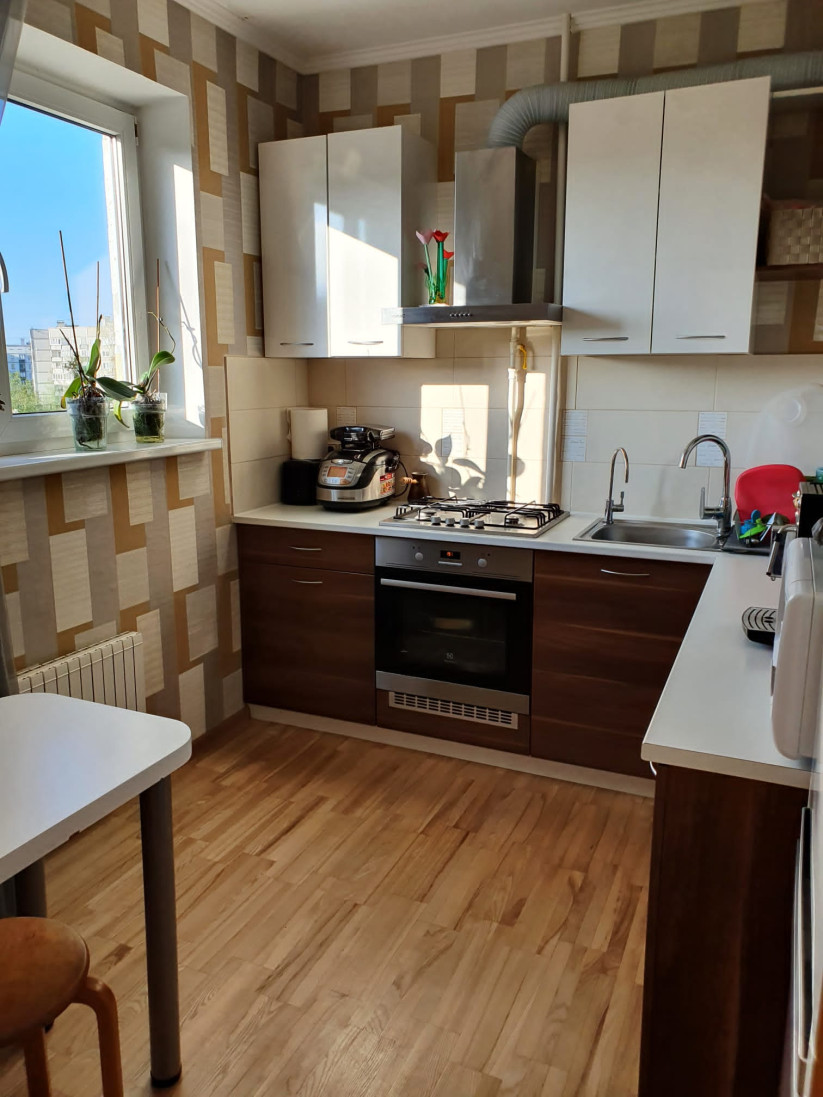 Kitchen with modern furniture and appliances.