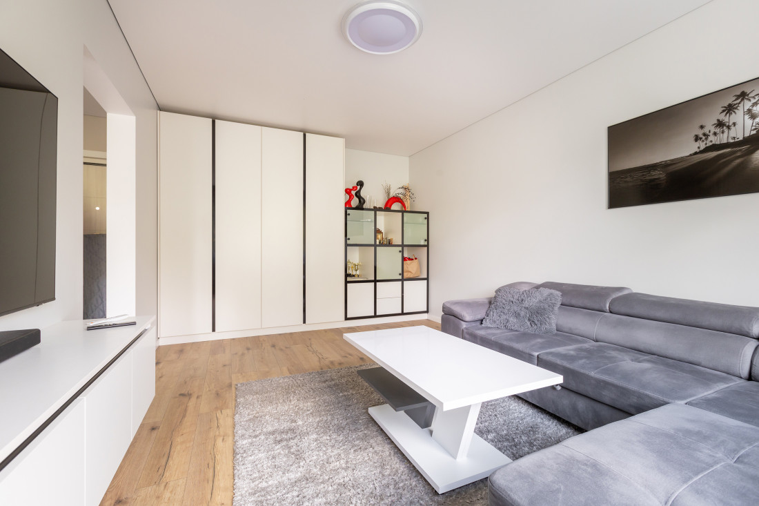 Living room with a gray sofa and table.