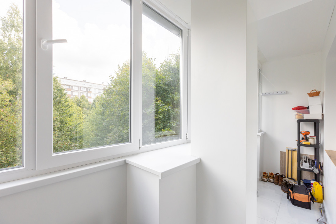 Balcony overlooking the yard with shelves.