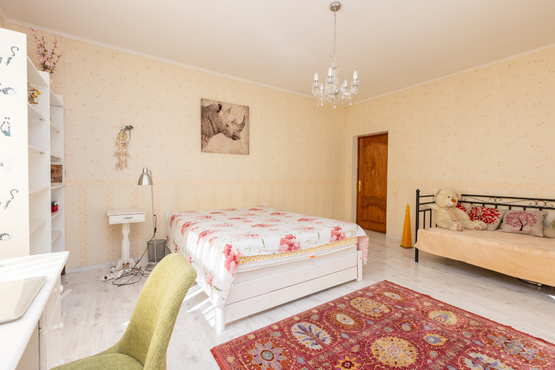 Bedroom with floral bedspread.