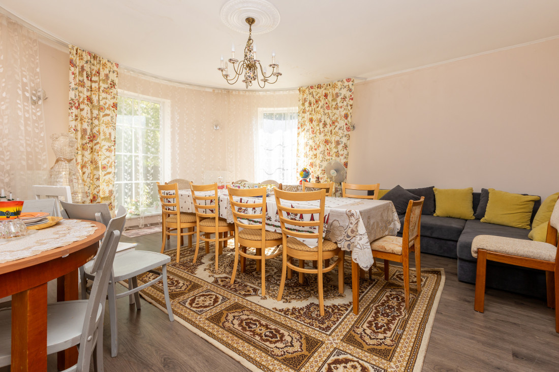 Family dining room with large window.