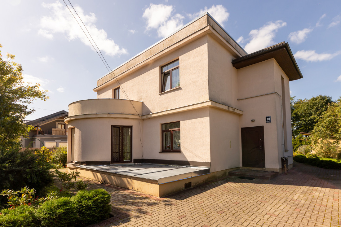 Front of the house with paved yard.