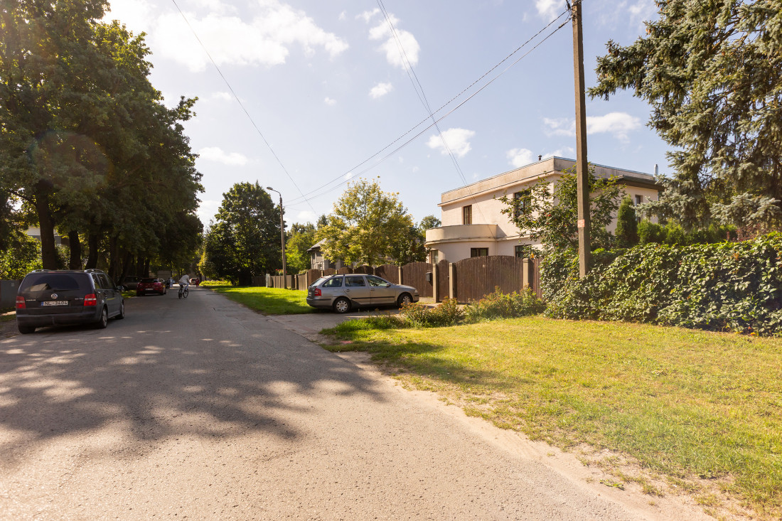 Street view near house with car.