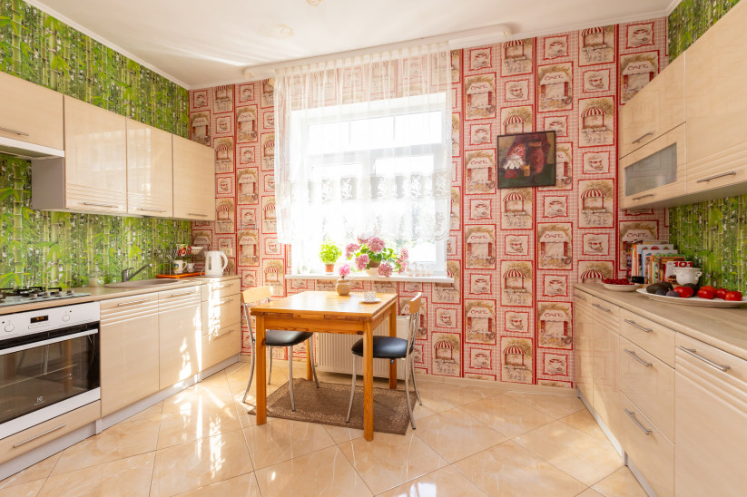 Spacious kitchen with decorative walls.