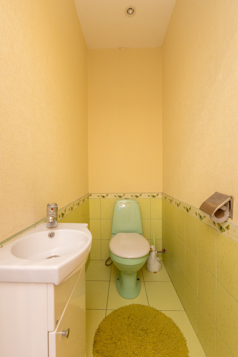 Small restroom interior with a sink.