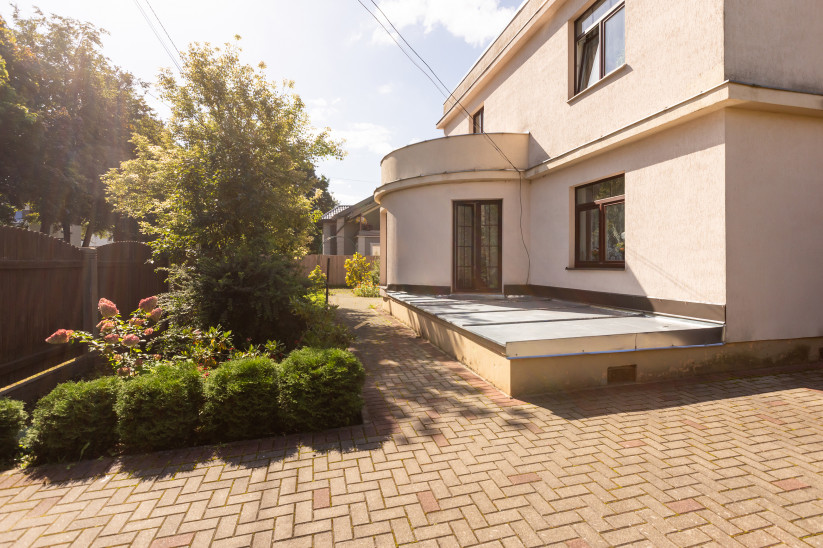 House terrace surrounded by greenery.