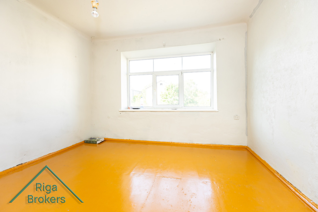 Simple bright room with a yellow floor.