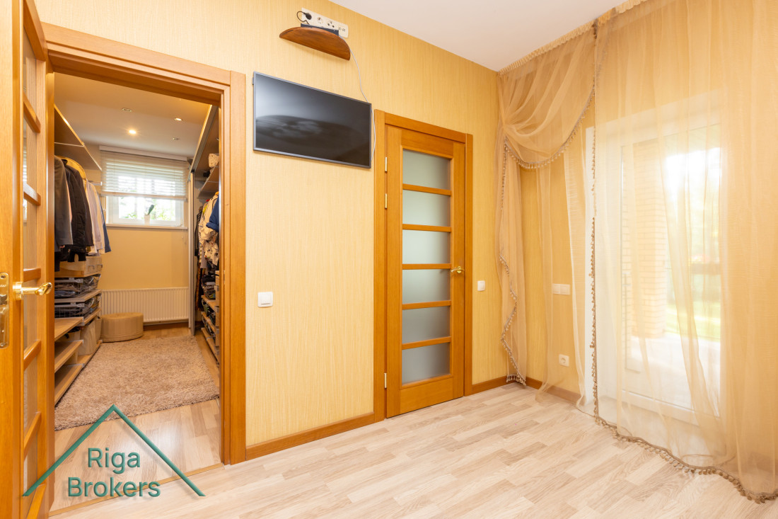 Room with access to wardrobe and windows.