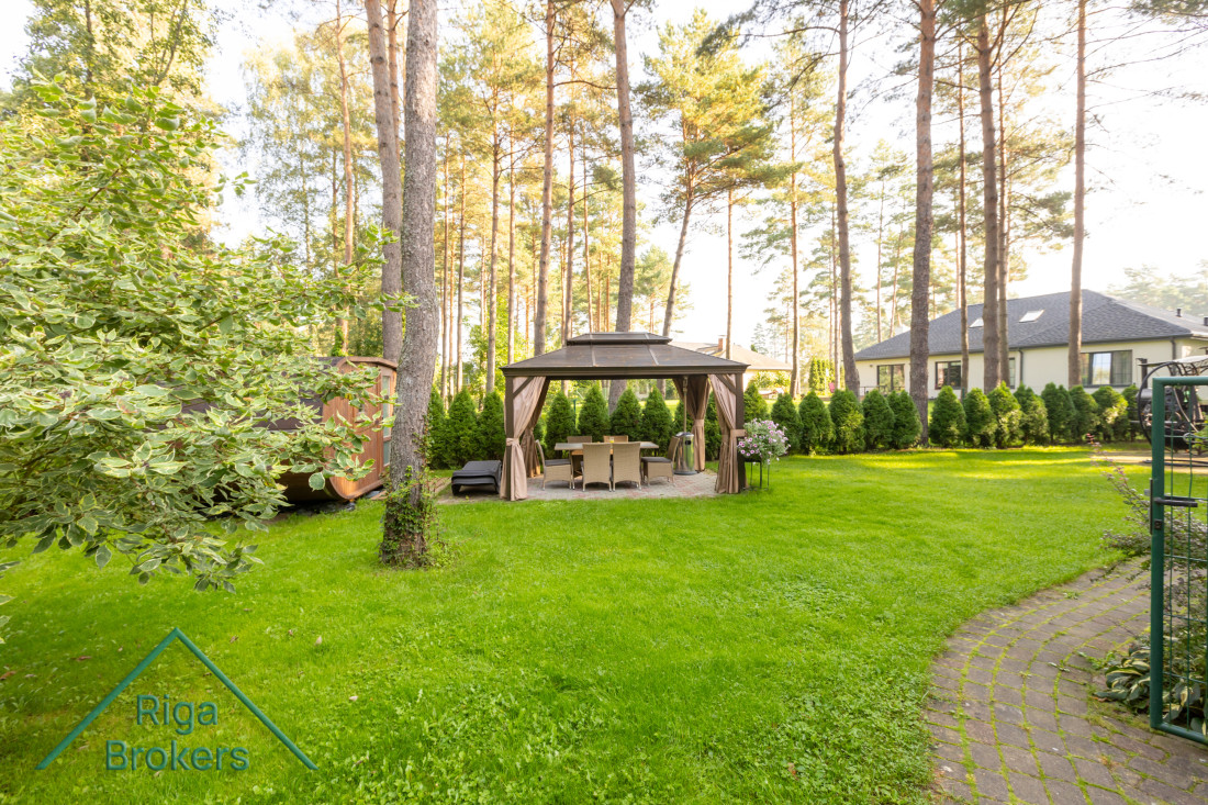 Garden gazebo with table and chairs.