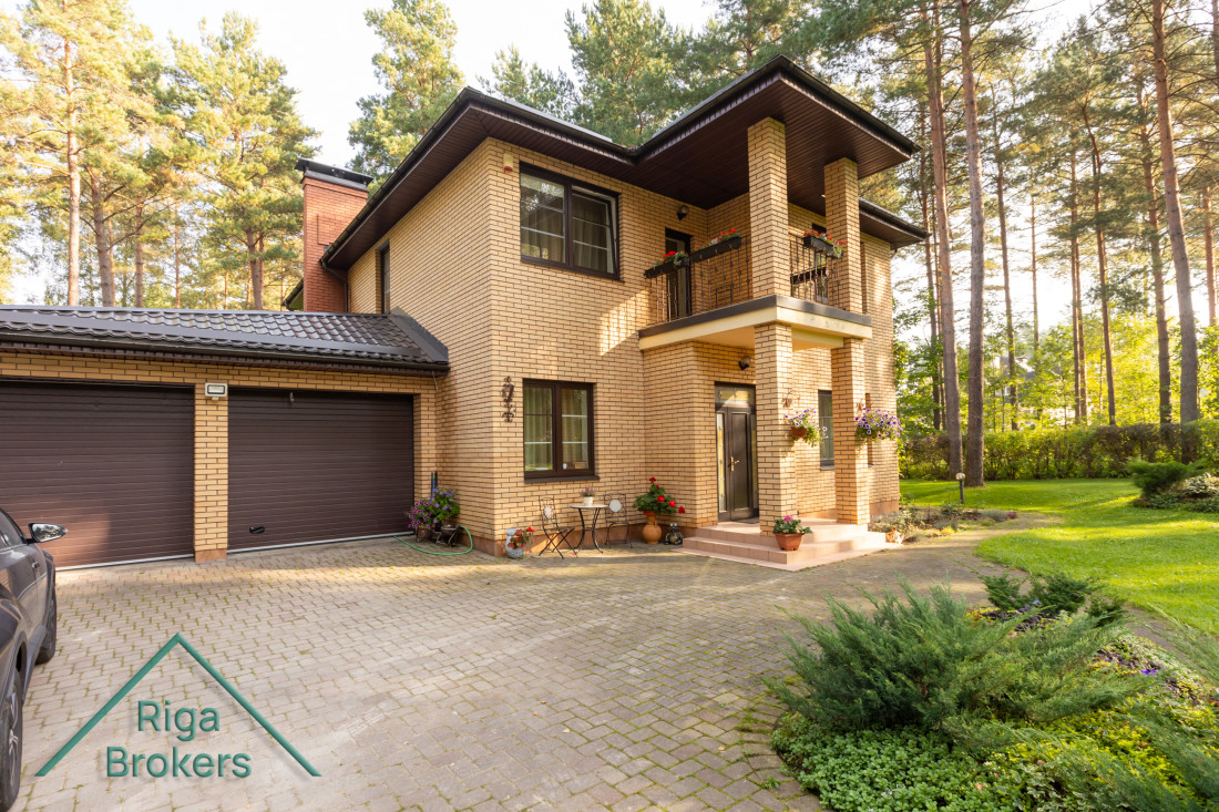 House near forest in a green area.