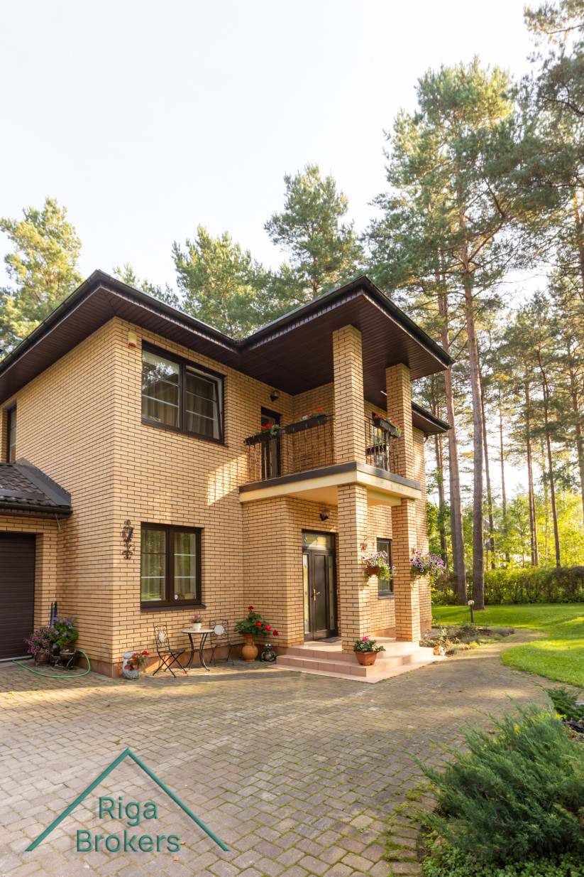 Front of the house with two garages.