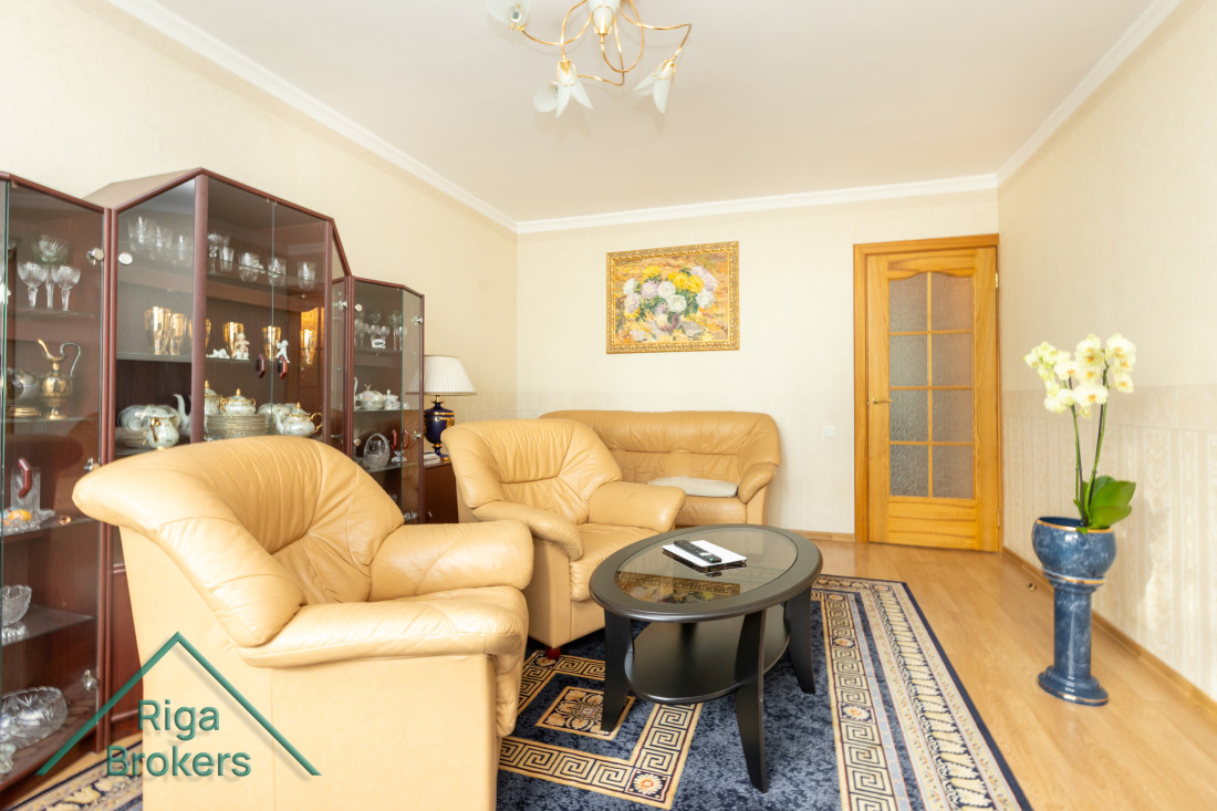 Living room with bright window and cozy furniture.