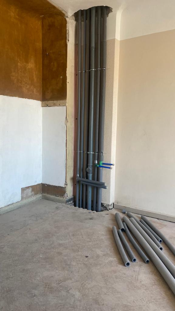 Pipes in the wall during renovation.