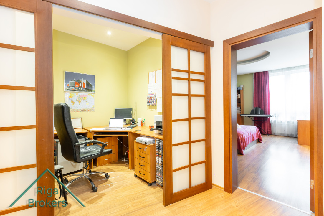 Home office with a computer and folders.