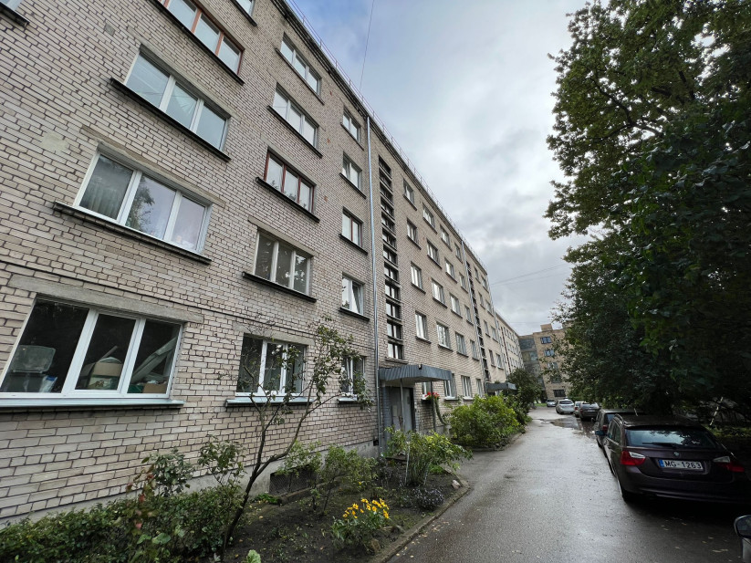 Brick apartment building with courtyard.