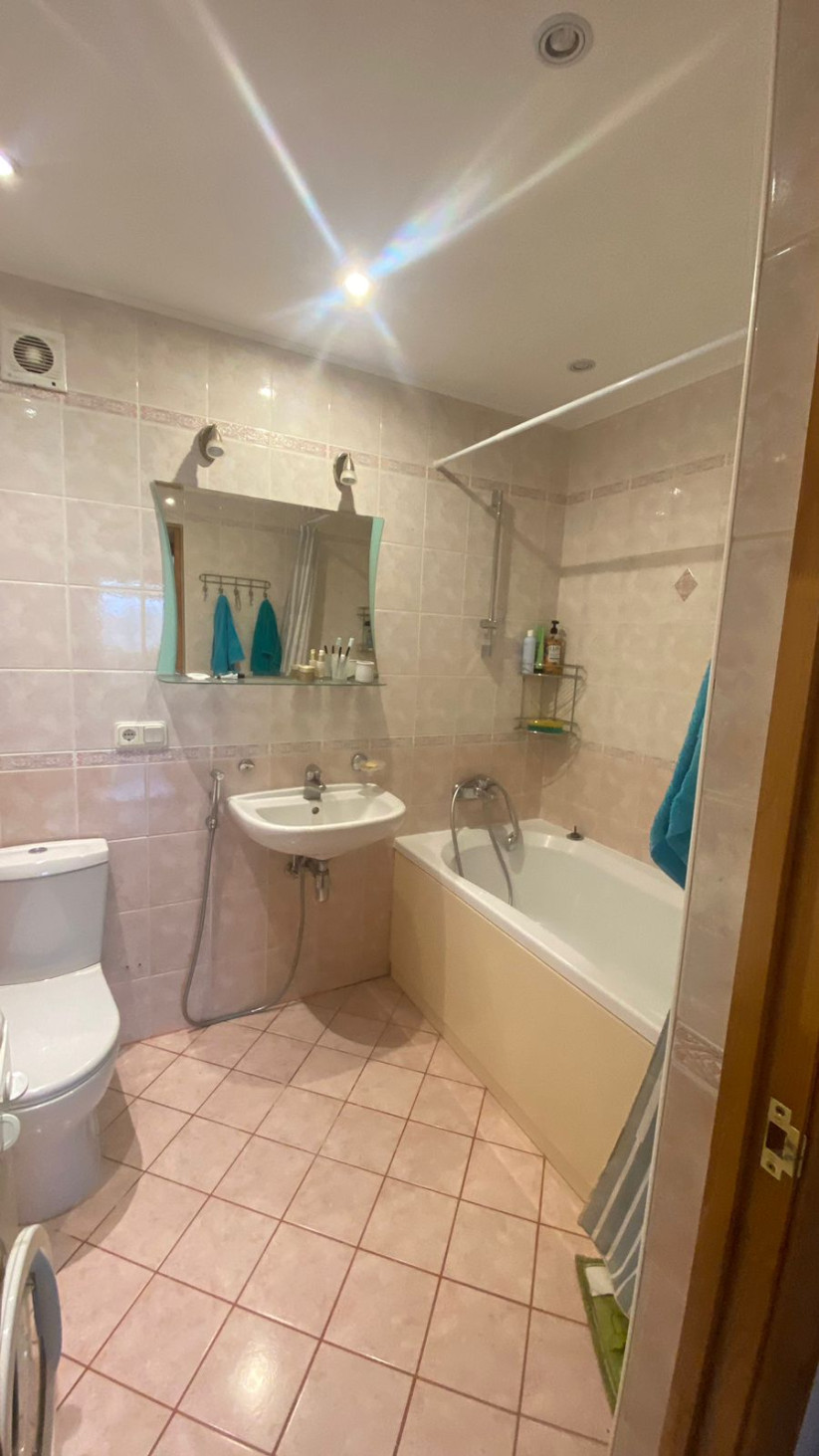 Bathroom with shower and bathtub.