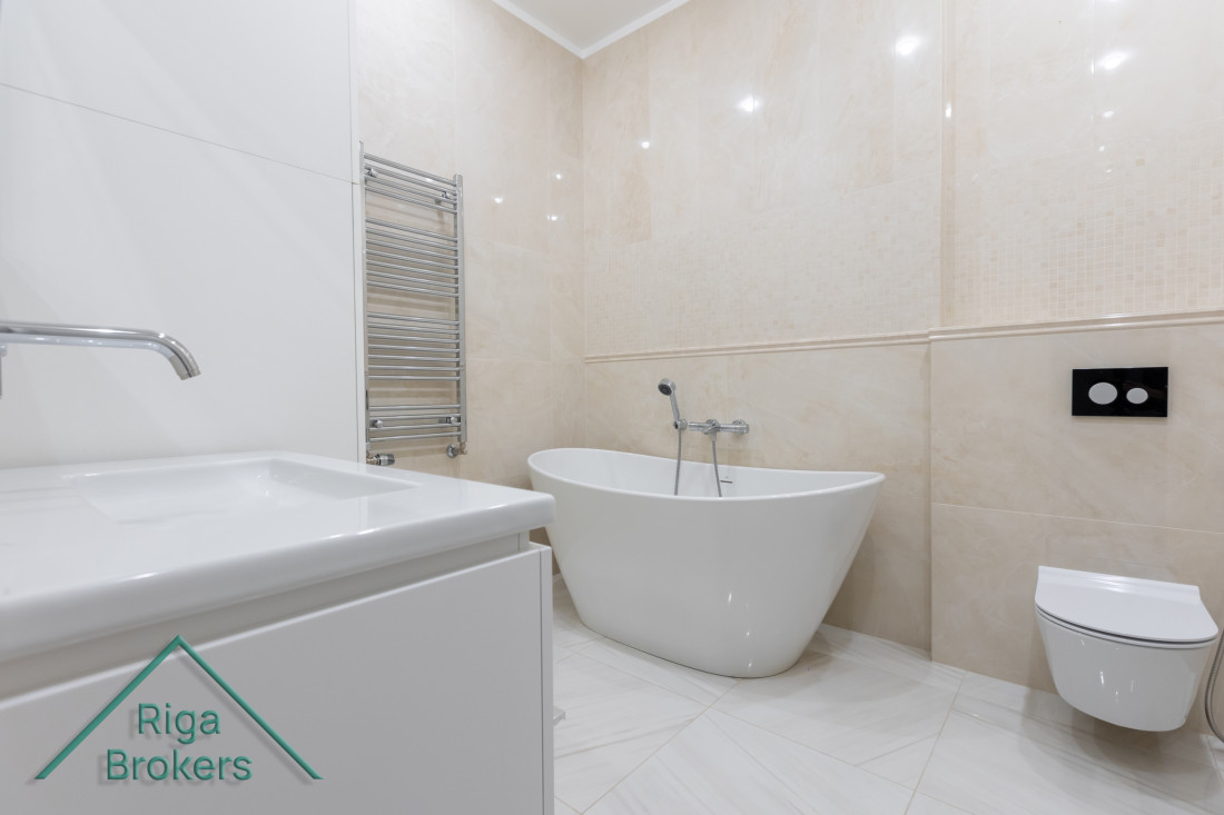 Elegant bathroom with freestanding bathtub.