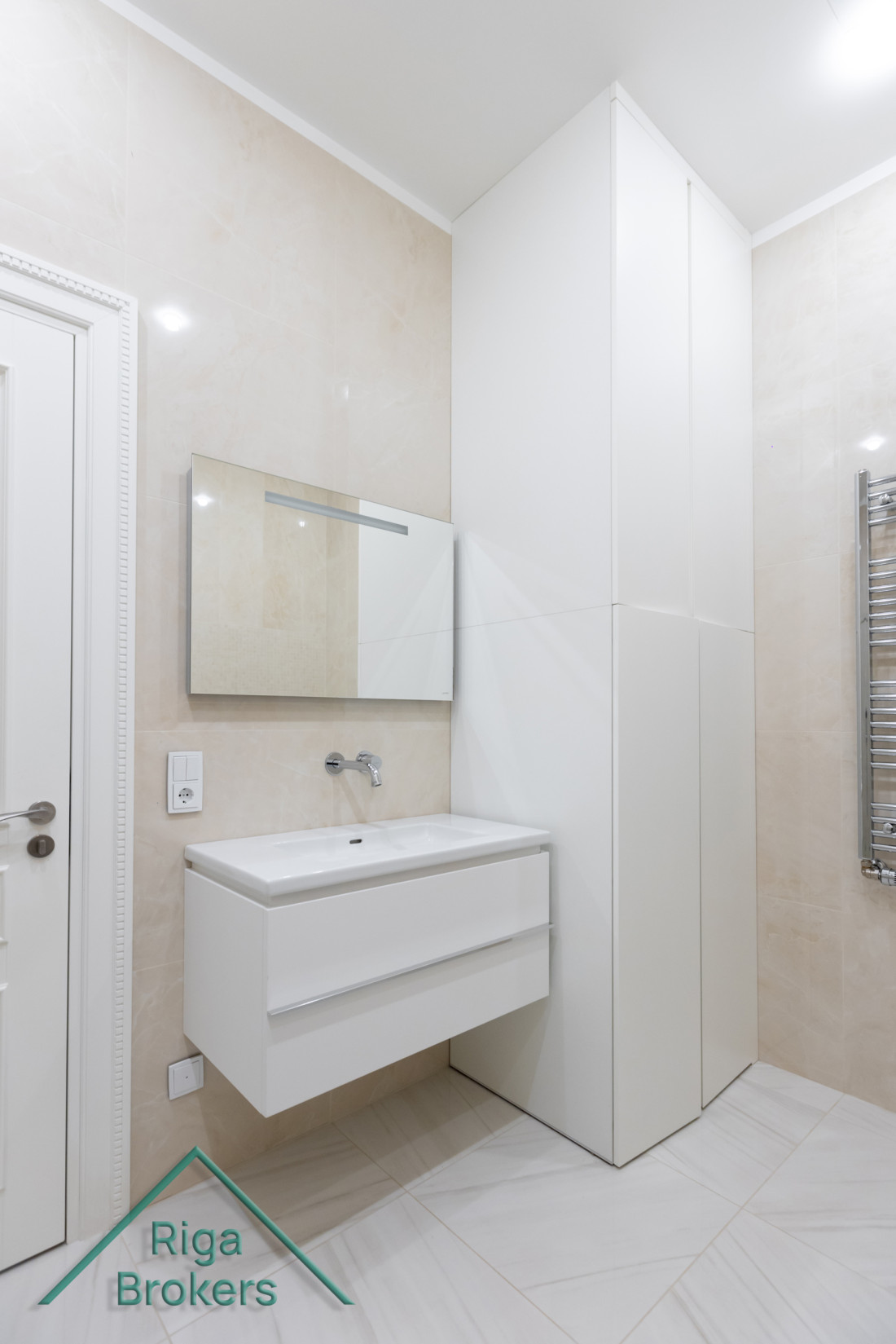Minimalistic bathroom sink with cabinet.
