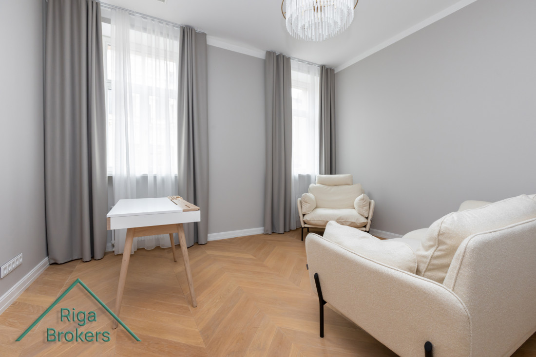 Elegant room with two chairs and a small table.