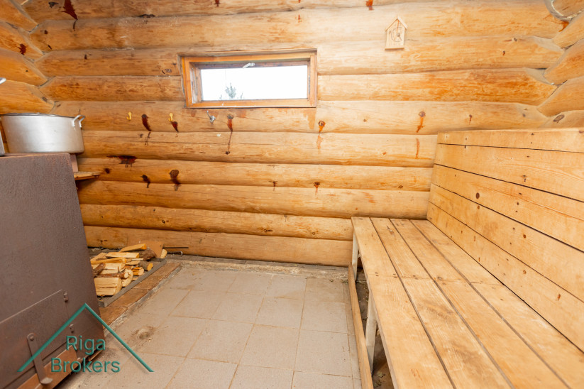 Wooden walls and bench in a rustic sauna.