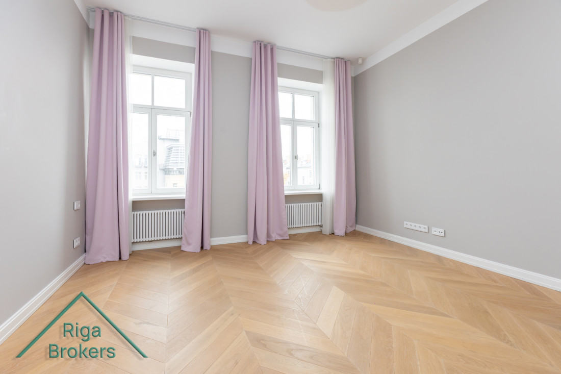  Room with light pink curtains.