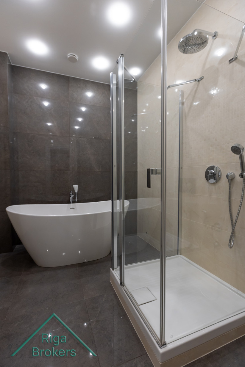 Freestanding tub and glass shower.