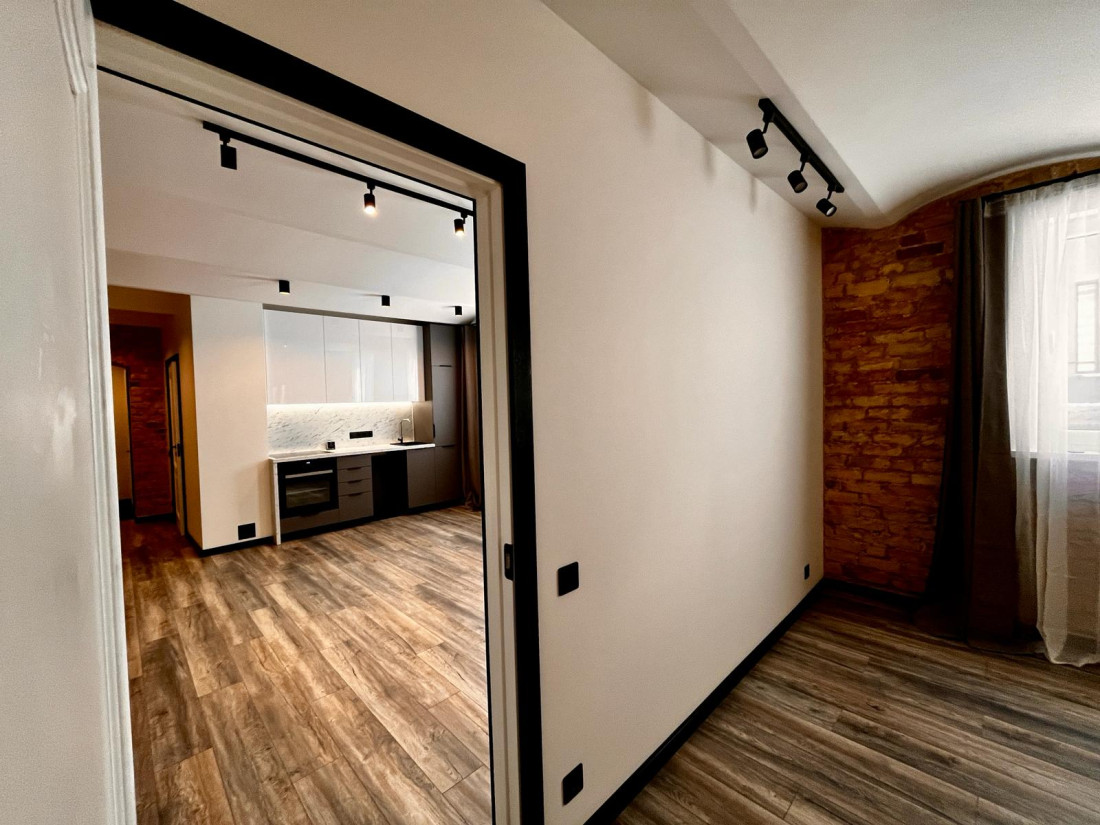 Open floor plan integrating kitchen and living area.